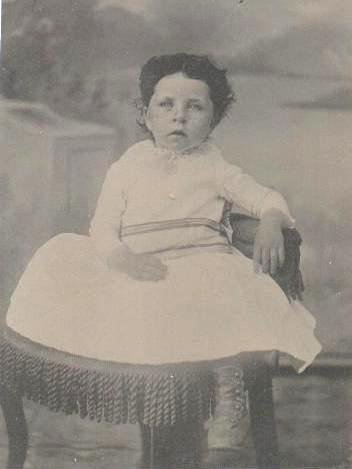 TINTYPE OF CUTE LITTLE GIRL SITTING IN CHAIR