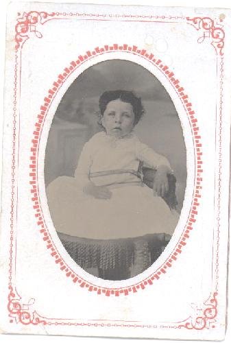 TINTYPE OF CUTE LITTLE GIRL SITTING IN CHAIR