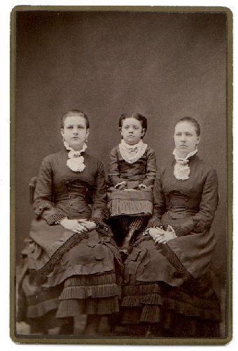 CABINET PHOTO OF THREE GIRLS IN VICTORIAN DRESS