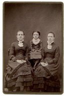 CABINET PHOTO OF THREE GIRLS IN VICTORIAN DRESS