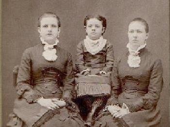 CABINET PHOTO OF THREE GIRLS IN VICTORIAN DRESS