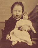 A GIRL & HER DOLL - 1870s TINTYPE PHOTOGRAPH