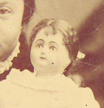 A GIRL & HER DOLL - 1870s TINTYPE PHOTOGRAPH