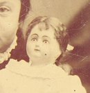 A GIRL & HER DOLL - 1870s TINTYPE PHOTOGRAPH