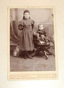 Portrait of Siblings and a Cardboard Cat - CABINET CARD