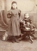 Portrait of Siblings and a Cardboard Cat - CABINET CARD