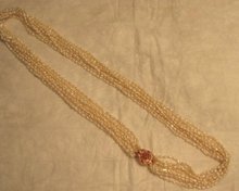 Glamorous 10 Strand Pearl Necklace with Pendant of Pink Sapphires and Diamonds Set in 18 Karat Gold
