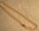 Glamorous 10 Strand Pearl Necklace with Pendant of Pink Sapphires and Diamonds Set in 18 Karat Gold