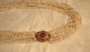 Glamorous 10 Strand Pearl Necklace with Pendant of Pink Sapphires and Diamonds Set in 18 Karat Gold