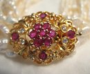Glamorous 10 Strand Pearl Necklace with Pendant of Pink Sapphires and Diamonds Set in 18 Karat Gold