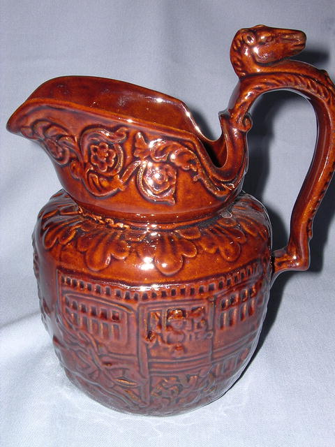BROWN POTTERY HORSE RACE PITCHER ROCKINGHAM STYLE
