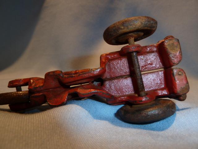 ANTIQUE CAST IRON RED CRASH CAR HARLEY WITH DRIVER AND CRASH CART