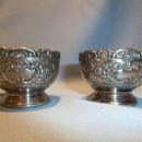 F.B. ROGERS PAIR OF SILVER PLATE ORNATE SALTS WITH COBALT LINERS