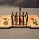 TWO MIDWINTER TOAST DISHES WITH ONE CHROME CENTER RACK THAT CAN BE USED ON EITHER TOAST