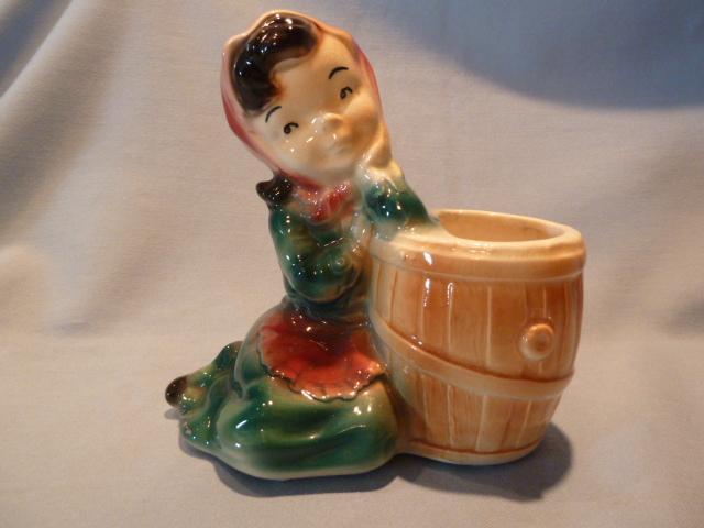 VINTAGE ROYAL COPLEY GIRL LEANING ON A BARREL PLANTER