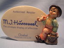 GOEBEL HUMMEL AUTHORIZED DEALER SIGN #187A WITH THE WANDERER FIGURINE, SIGNED