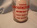 VINTAGE QUALITY AND SERVICE DAIRY RED LION, PA RED PYRO ROUND QUART BOTTLE