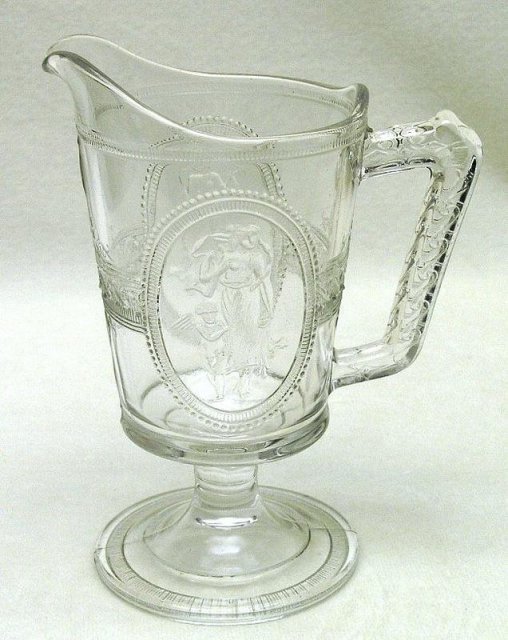 EAPG Cupid and Venus Footed Milk Pitcher