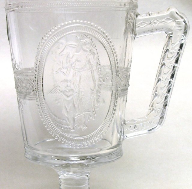 EAPG Cupid and Venus Footed Milk Pitcher