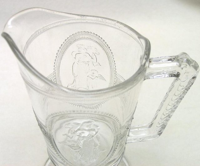 EAPG Cupid and Venus Footed Milk Pitcher