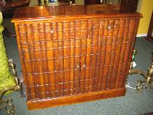 SMALL MAHOGANY CUPBOARD WITH FAUX BOOK FRONT DOORS