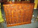 SMALL MAHOGANY CUPBOARD WITH FAUX BOOK FRONT DOORS