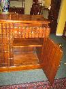 SMALL MAHOGANY CUPBOARD WITH FAUX BOOK FRONT DOORS
