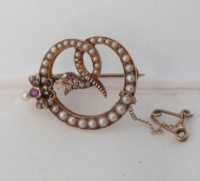 Victorian 18 Kt. Gold and Pearls and ruby Serpent Brooch