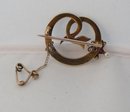 Victorian 18 Kt. Gold and Pearls and ruby Serpent Brooch
