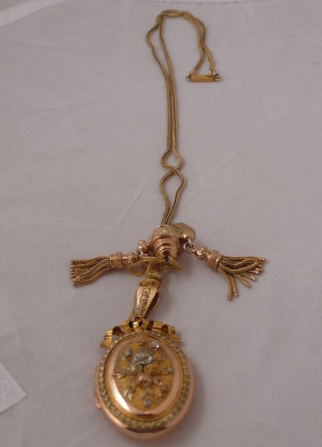 18 Ct. tri color gold locket with slide