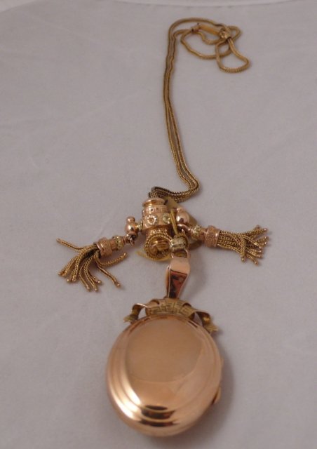 18 Ct. tri color gold locket with slide