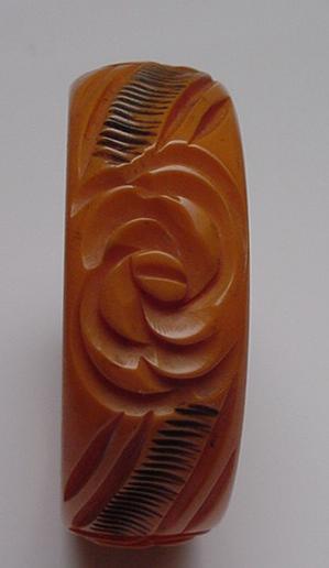 Bakelite Butterscotch and Black Carved Flower Bangle