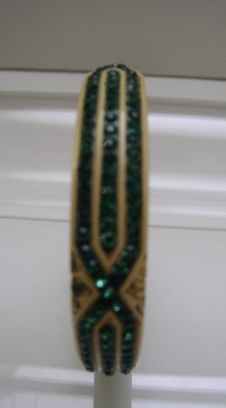 Celluloid cream colored bangle with green