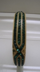 Celluloid cream colored bangle with green