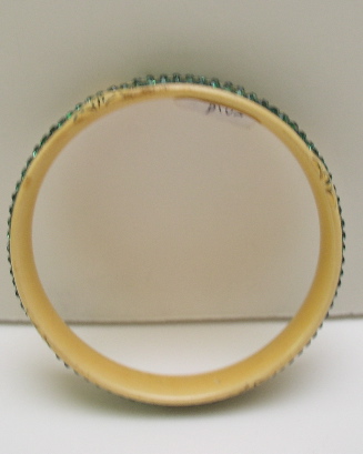 Celluloid cream colored bangle with green