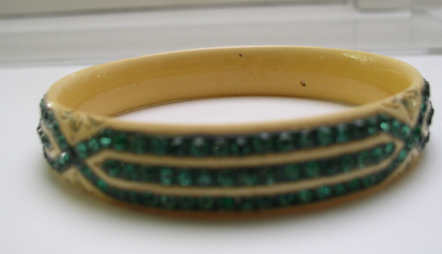 Celluloid cream colored bangle with green