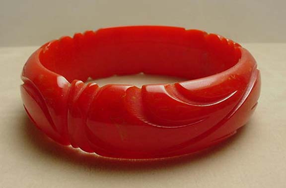 Bakelite Coral Red Carved Bangle