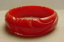 Bakelite Coral Red Carved Bangle