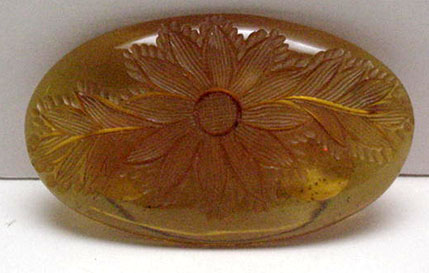 Bakelite vintage applejuice carved brooch