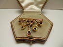 Edwardian 15 Ct. Gold and Garnet Brooch