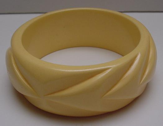 Bakelite Wide Taffy Colored Carved Bangle