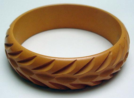 Bakelite butterscotch carved bangle