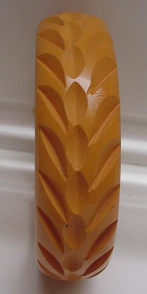 Bakelite butterscotch carved bangle