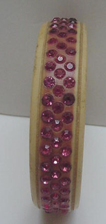 Celluloid bangle with pink rhinestones