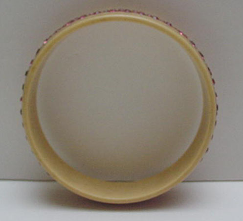 Celluloid bangle with pink rhinestones