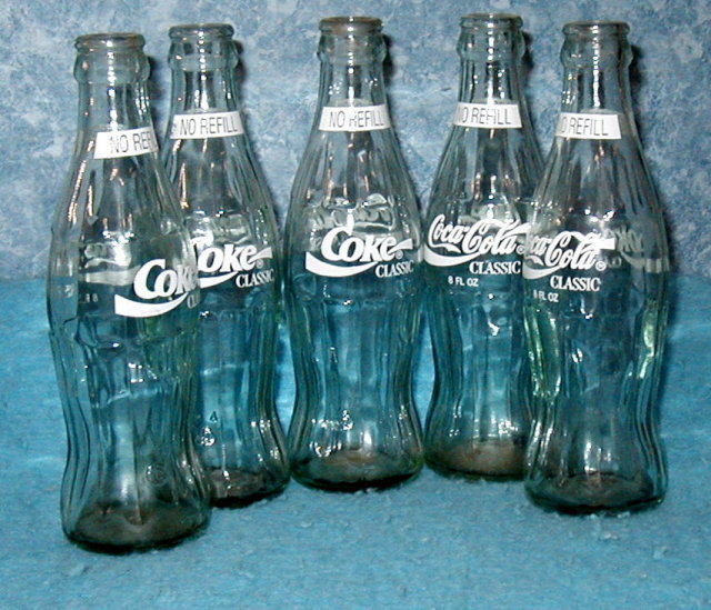 Coke Bottles (4) light green colored glass