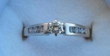 14K WHITE GOLD ENGAGEMENT RING.