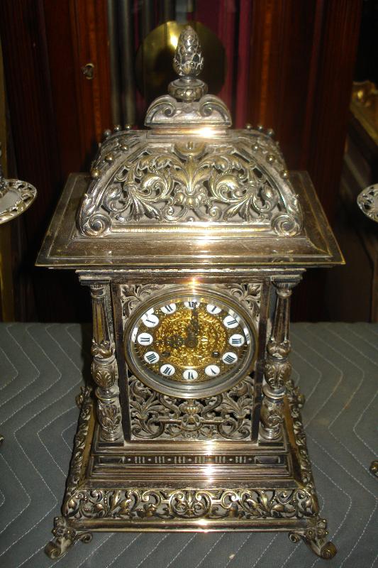 Nineteenth Century French Theree Piece Clock Set Silver Over Bronze, Pierced In The Moorish Orientalist Style, With Matching Candelabra