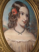 Mid-Nineteenth Century American Pastel on Paper Laid Down on Board of a Beautiful Young Lady with a Flower in Her Hair