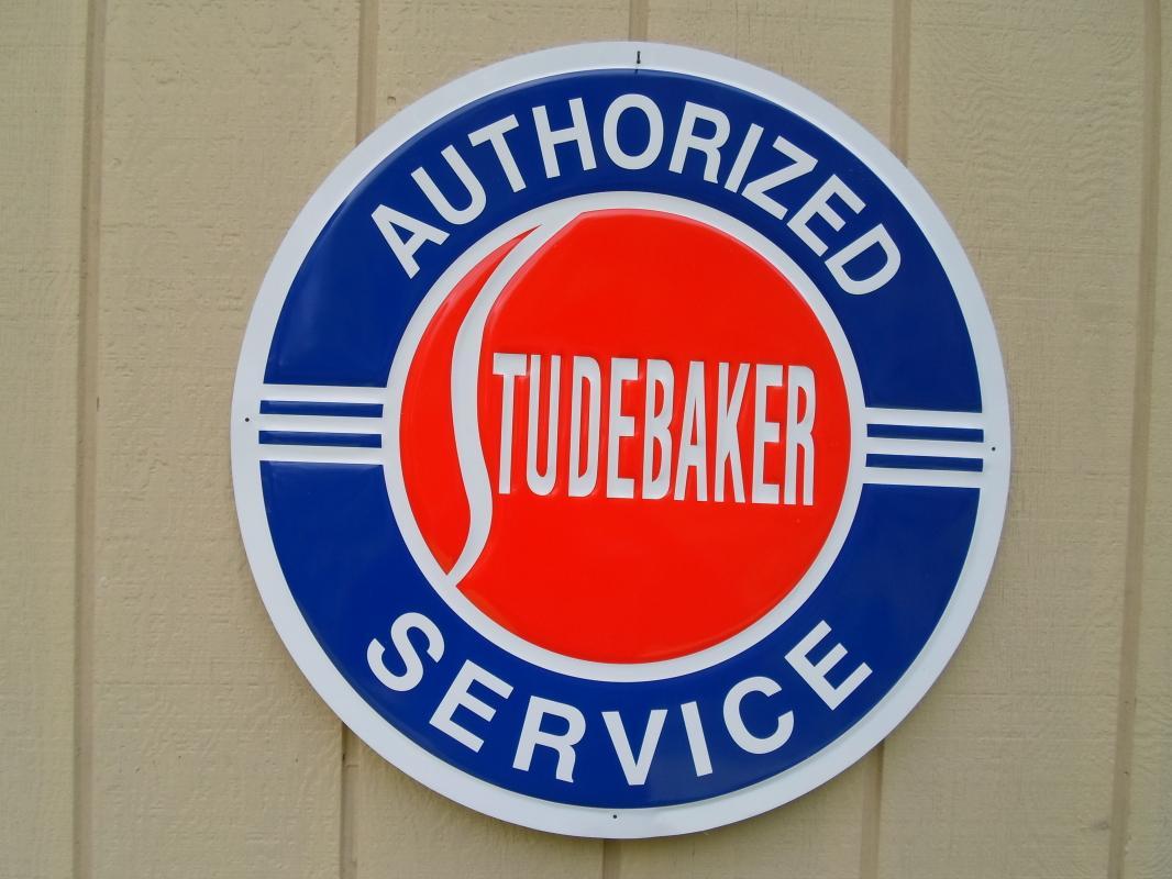 OUR LARGEST AUTHORIZED STUDEBAKER SERVICE GARAGE METAL SIGN // MADE IN USA